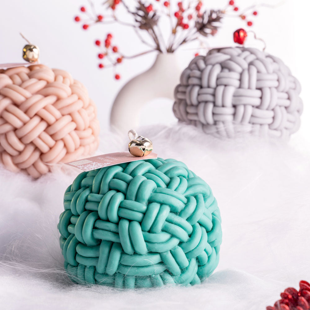 A knit ball candle is a unique and charming decorative candle